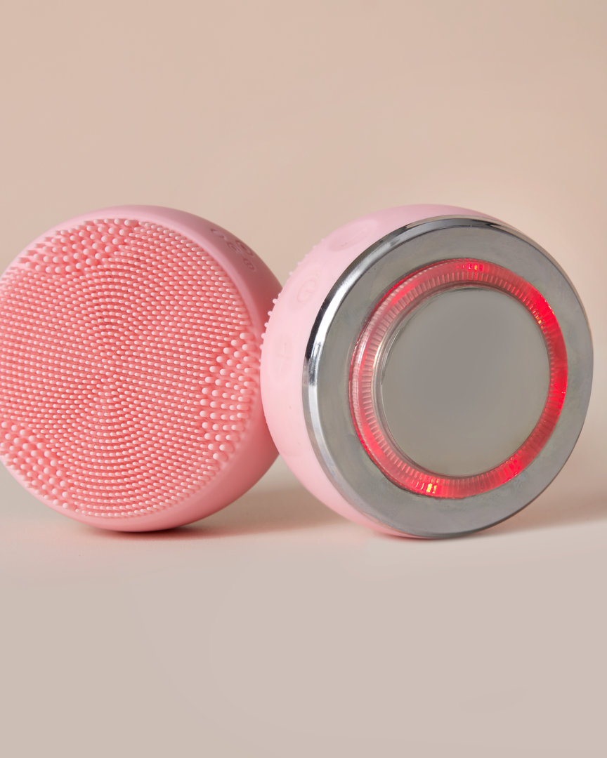 A Japanese skincare device, the IREN Shizen SKIN GENIE PRO Cleansing Brush, features customizable skincare benefits and LED light therapy with a red light.