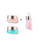 The MOCHI SKIN Instant Glow Travel Set by Fast Bundle includes two jars (pink and blue) and a pink dropper bottle, each with metallic gold caps, shown on a white background.