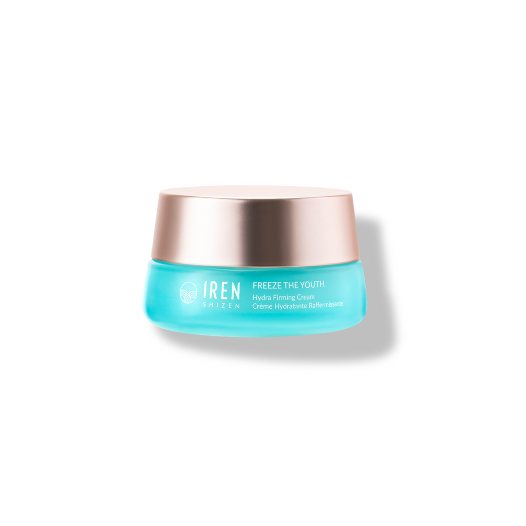 A container of IREN Shizen FREEZE THE YOUTH Hydra Firming Cream with grape extract on a white background.