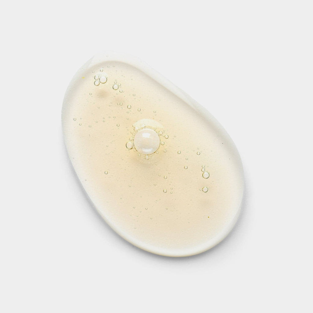 A white plate with a drop of IREN Shizen's CLEARER DAYS Anti-Blemish Serum, a Japanese skincare product.